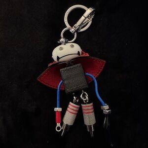 Prada ,  bag charm . Robot Keychain with Red Cape and Blue Legs.